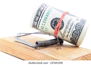 Dollar Banknotes Roll In A Mousetrap As Concept Of Money Security Or Bait