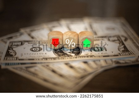 Dollar Bills and Dice Analyzing Currency Fluctuations, Risk Management, and the US Federal Reserve Policy Through Red-Green Arrow Displays and Percentages