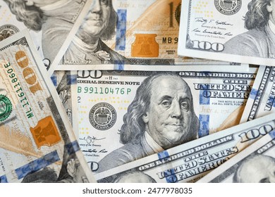 Dollar bills lined up on the table, concept of the dollar value, raising and lowering interest rates to solve the problem of inflation. - Powered by Shutterstock