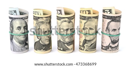 Dollar bills rolled up and tied with a rope. Isolated on white background