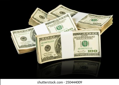 The Dollar Money Bills In Stack On Black Background