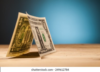 dollar money closeup on wooden table and blue background