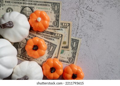 Dollar Money With Pumpkin Decorating On Stone Background