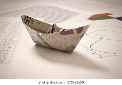 Dollar Paper Boat On Data 