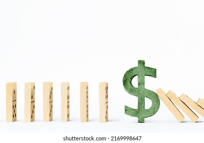 dollar sign prevents wooden domino blocks from falling. stabilization and risk resistance concept