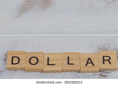 Dollar wooden letters on wood vintage background