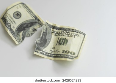 Dollars bill torn as background.