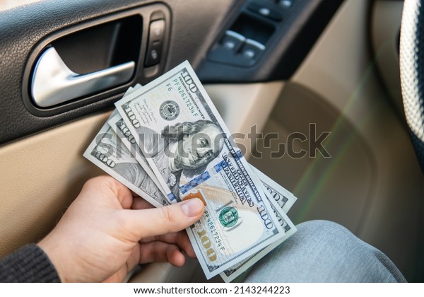 dollars with a car key lie in inside\
cars. financial concept money dollar in car\
financial