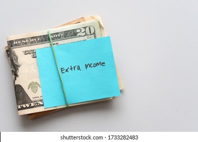 Dollars cash money and paper note with text written SIDE HUSTLE on copy space background - concept of financial planning - make more extra money from parttime side hustle or second job - Shutterstock ID 1733282483