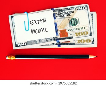 Dollars Cash Money ,pencil On Red Copy Space Background With Note Written EXTRA INCOME ,concept Of Full Time Employee Boost Earnings Make More Income From Part Time Side Job ,side Hustle Or Side Gig