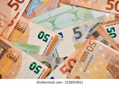 Dollars and Euro banknotes - photo of real money. Dollars and Euro as background for financial concept. Commercial result of trading. Real money for productive business. EUR paper. Fiat currency. - Shutterstock ID 2128555811