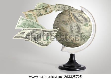 Dollars globe with dollars flying on gray background.
