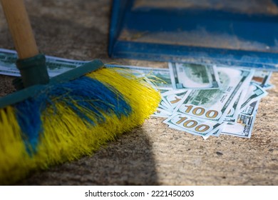 Dollars Ground Are Collected With A Brush In A Scoop. Dirty Money Fight Concept.