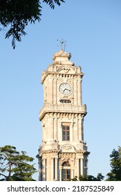 Dolmabahce Clock Tower with tree and blue sky. Selective focus area. Copy space area. - Shutterstock ID 2187525849