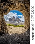 Dolomites, Alpi Dolomiti beautiful scenic mountain landscape under blue sky in summer. Rocky tower peak summits of the Alps on a sunny day. Alpine scenic view of the cliffs and climbing walls in Italy