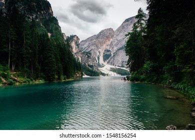 Dolomites, Italy - July, 2019: Spectacular romantic place with typical wooden boats on the alpine lake, Dolomites, South Tyrol, Italy, Europe - Shutterstock ID 1548156254