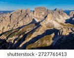 Dolomites mountain views with dramatic limestone peaks, alpine ridges, and wide valleys in northern Italy. High altitude landscape showing distinctive geology, European Alps scenery, outdoor travel destination, hiking and climbing area, natural environment, and panoramic mountain background