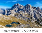 Dolomites mountain views with dramatic limestone peaks, alpine ridges, and wide valleys in northern Italy. High altitude landscape showing distinctive geology, European Alps scenery, outdoor travel destination, hiking and climbing area, natural environment, and panoramic mountain background