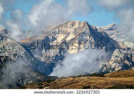 Dolomites mountains covered with clouds