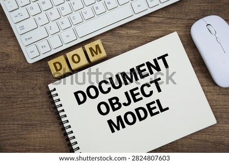 DOM Document Object Model message with keyboard and optical mouse on wooden background