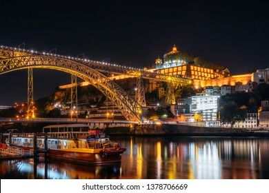 Dom Luis I Bridge, Medieval Monastery Fort Mosteiro Da Serra Do Pilar And Boat With Illumination, Porto Old Town, Portugal