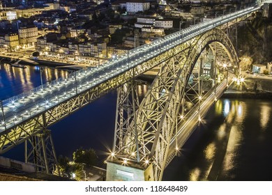 Dom Luis bridge over Douro river at night in Porto Portugal