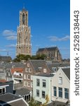 Dom Tower of Utrecht surrounded by historic buildings in the center of Utrecht, In 2024 after 5 years of restoration. A horizontal photo.