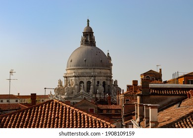 The dome of the Basilica di Santa Maria della Salute over the roofs of Venice, Veneto, Italy – August 20th 2020