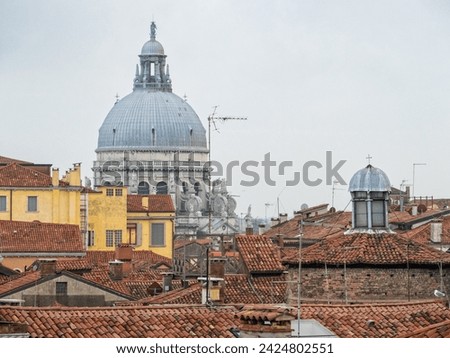 The dome of the Basilica di Santa Maria della Salute (Saint Mary of Health) above the roofs - Venice, Veneto, Italy