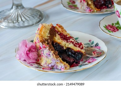 Dome Cake - Filled With Fruity Jelly, Dark Chocolate Mousse And Raspberry Puree, Covered With White Chocolate Ganache And Decorated With Colorful Sprinkles