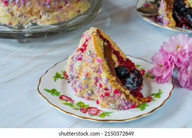 Dome Cake - Filled With Fruity Jelly, Dark Chocolate Mousse And Raspberry Puree, Covered With White Chocolate Ganache And Decorated With Colorful Sprinkles