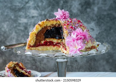 Dome Cake - Filled With Fruity Jelly, Dark Chocolate Mousse And Raspberry Puree, Covered With White Chocolate Ganache And Decorated With Colorful Sprinkles