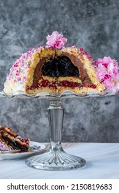 Dome Cake - Filled With Fruity Jelly, Dark Chocolate Mousse And Raspberry Puree, Covered With White Chocolate Ganache And Decorated With Colorful Sprinkles