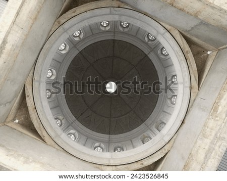 The dome ceiling of the mosque is made of molded concrete at the center position.