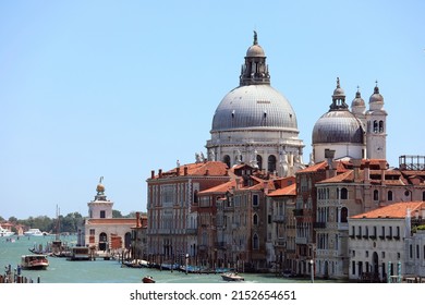 Dome of the church called MADONNA DELLA SALUTE on the Grand Canal in Venice in Italy and the vaporetto boat