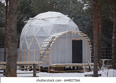 Dome house in forest. Geodesic architecture. Construction of a frame house. - Powered by Shutterstock