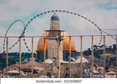 Dome of the Rock through barbed wire in Old Jerusalem, Palestine - Powered by Shutterstock