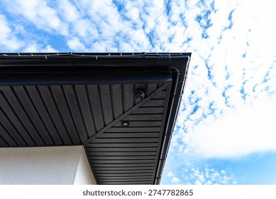 Dome security camera installed on an outdoor soffit providing property surveillance