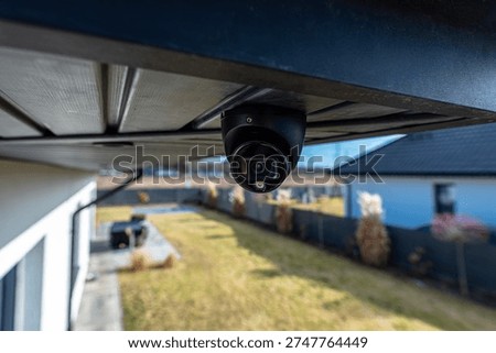 Dome security camera installed on an outdoor structure for home monitoring and surveillance
