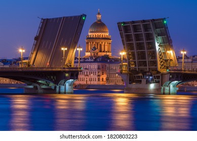 The dome of St. Isaac Cathedral in the alignment of the divorced Annunciation bridge on a white night. Saint Petersburg, Russia - Powered by Shutterstock