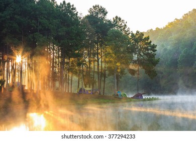 Dome tents beside the lake in the mist at sunrise at Pang Ung (Pang Tong reservoir), Mae Hong Son province, Thailand - Shutterstock ID 377294233