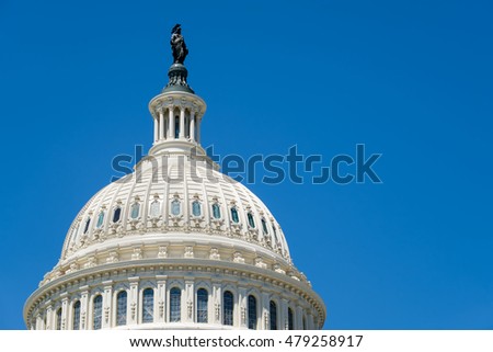 The dome of the US Capitol at Washington D.C. on a blue sky background