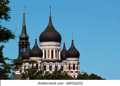 Domes of Alexander Nevsky Orthodox Cathedral and spire of St. Mary's Church in the Old Town of Tallinn, Estonia.