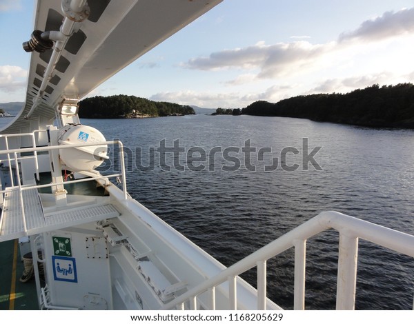 Domestic car ferry. Cruising at evening on\
fjord near Stavanger. Norway. 28th July\
2012