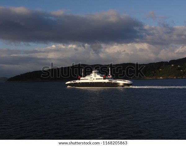 Domestic car ferry. Cruising at evening on\
fjord near Stavanger. Norway. 28th July\
2012