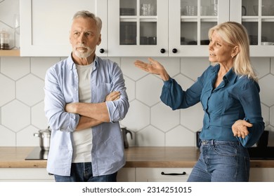 Domestic Conflicts. Portrait Of Senior Couple Arguing In Kitchen Interior, Angry Mature Lady Shouting At Her Husband At Home, Elderly Spouses Suffering Misunderstanding And Marital Crisis, Closeup - Powered by Shutterstock