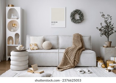 Domestic and cozy christmas living room interior with corduroy sofa, white shelf, mock up poster frame, christmas decoration, wreath, stars, gifts and accessories. Home decor. Family time. Template.
