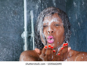 Domestic Lifestyle Portrait Of Young Happy And Beautiful Black Afro American Woman Smiling Happy Taking A Shower At Home Bathroom Washing Her Hair With Shampoo In Beauty And Hygiene Concept