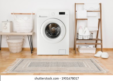 Domestic room with washing machine, baskets and laundry essential things