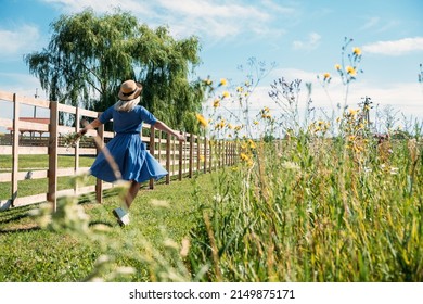 Domestic Travel, Local Travel, Summer Country Travel. Countryside Getaways, Country vacations, Farm Stays. Young woman in straw hat enjoys summer vacation at the farm in countryside - Shutterstock ID 2149875171